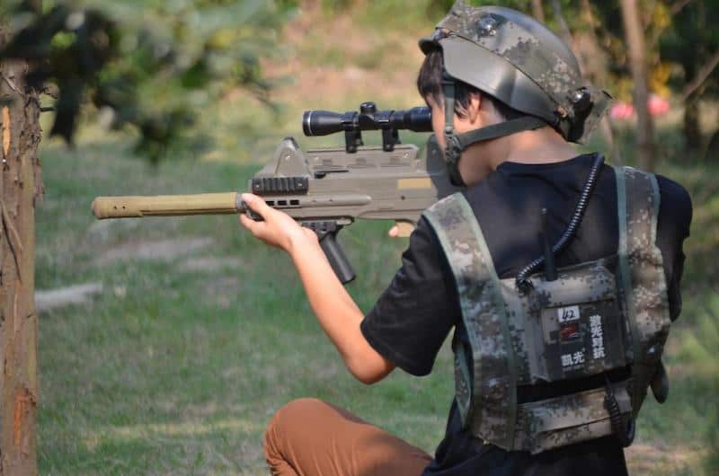 boy playing laser tag game