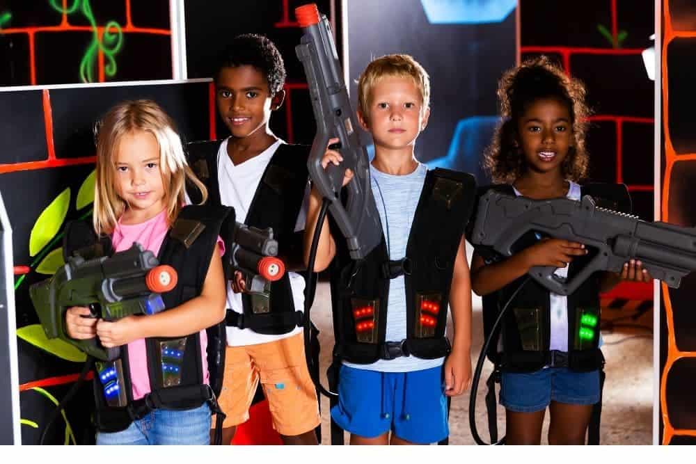 Young children play laser tag