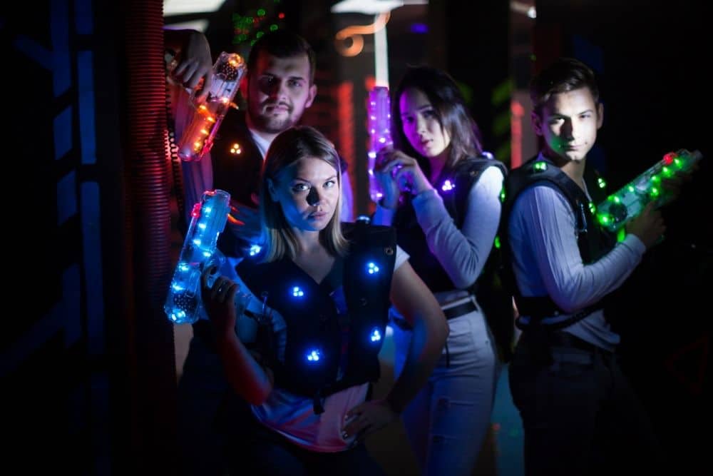 adults playing laser tag