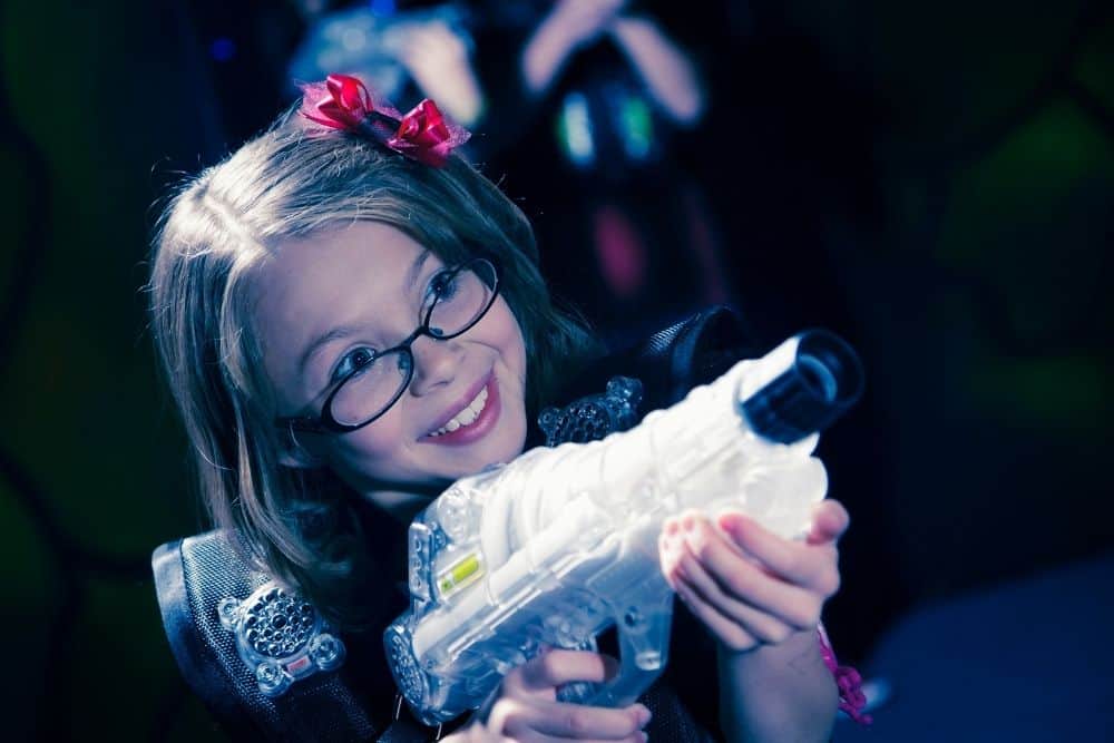 girl wearing accessories to laser tag